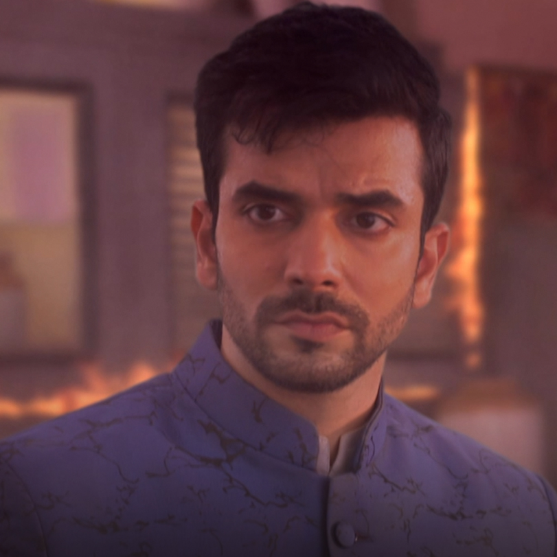 Rishab enters the burning hall in order to help Karan in rescuing Brit